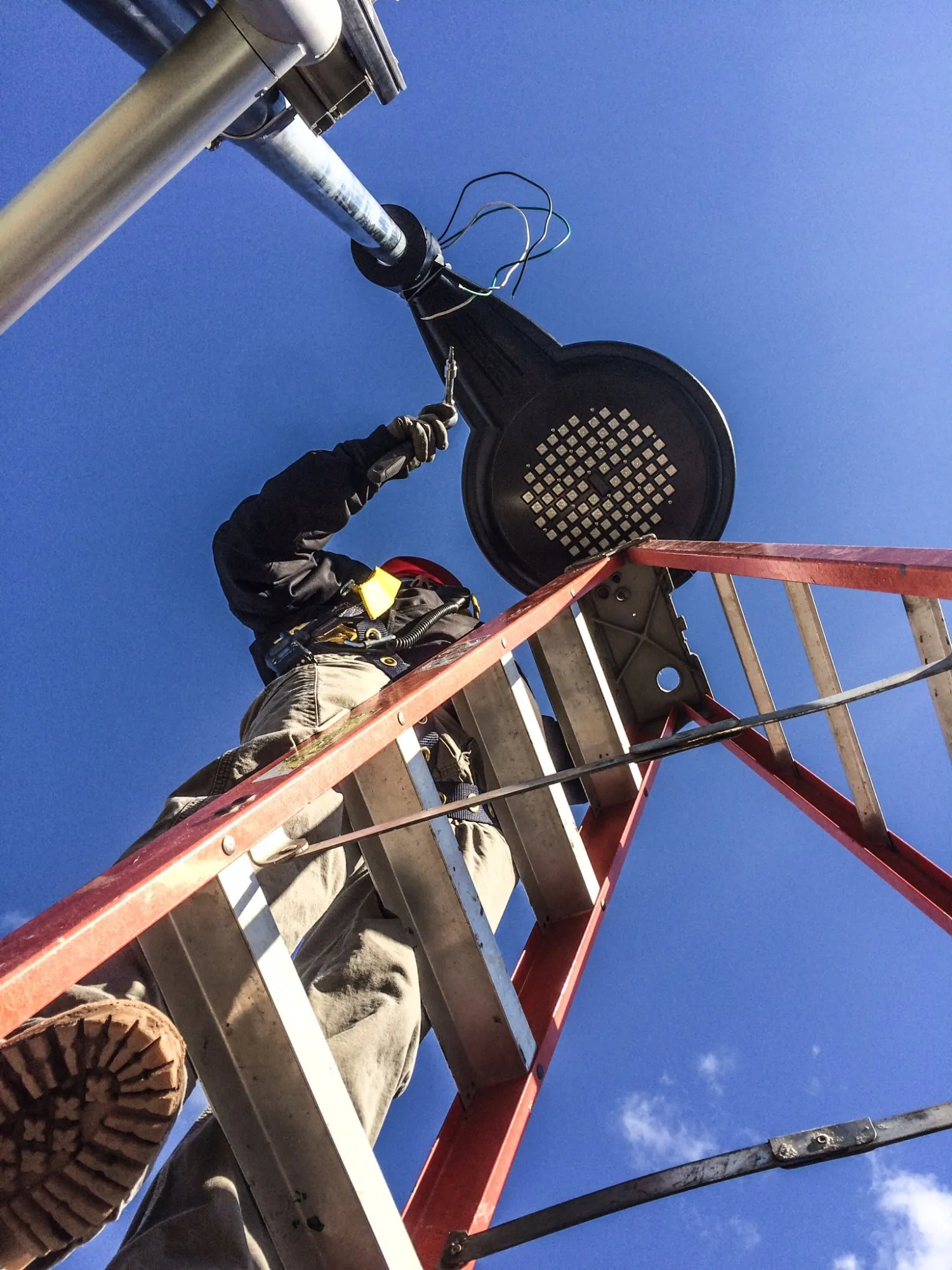 Martel Electric electrician working on outdoor lighting installation